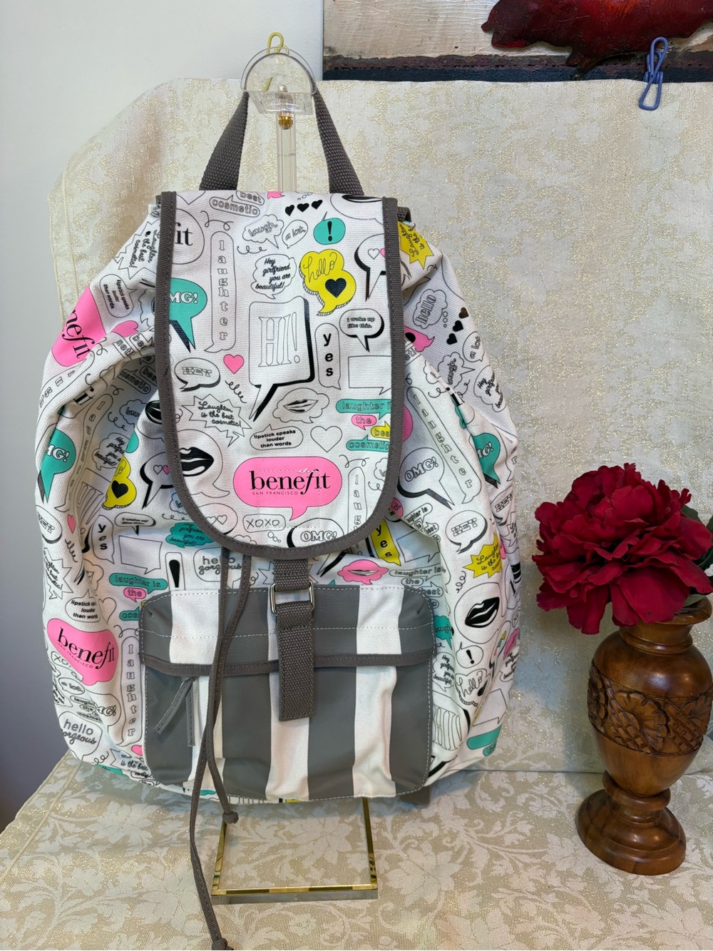 Benefit White Canvas Graphic Backpack with Pink, Teal & Yellow Accents